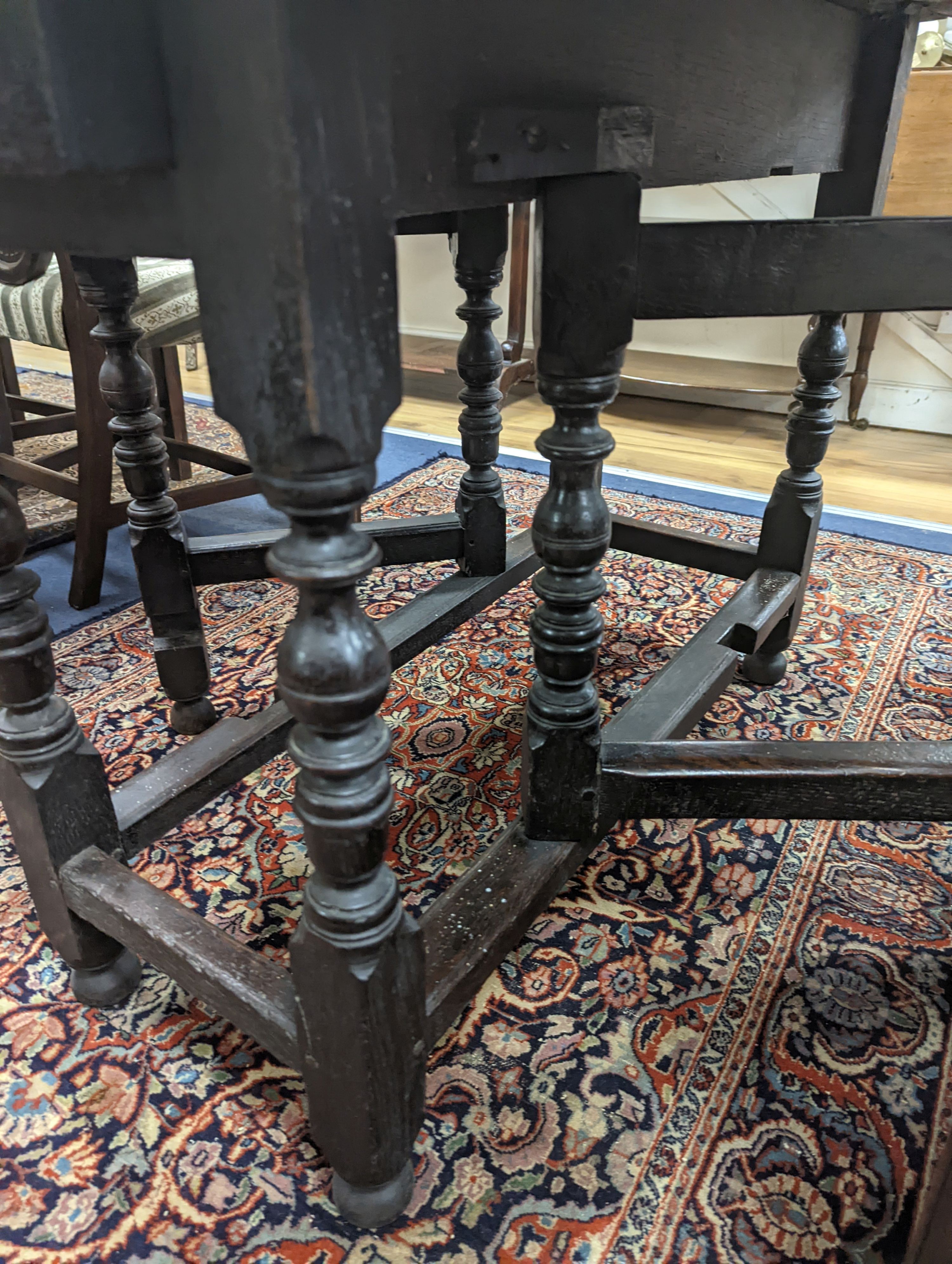 An oak gateleg table. W-107cm, D-105cm, H-73cm. - Image 3 of 4