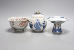 A Chinese blue and white water pipe vessel, a doucai stem dish and a Japanese Imari bowl, 19th
