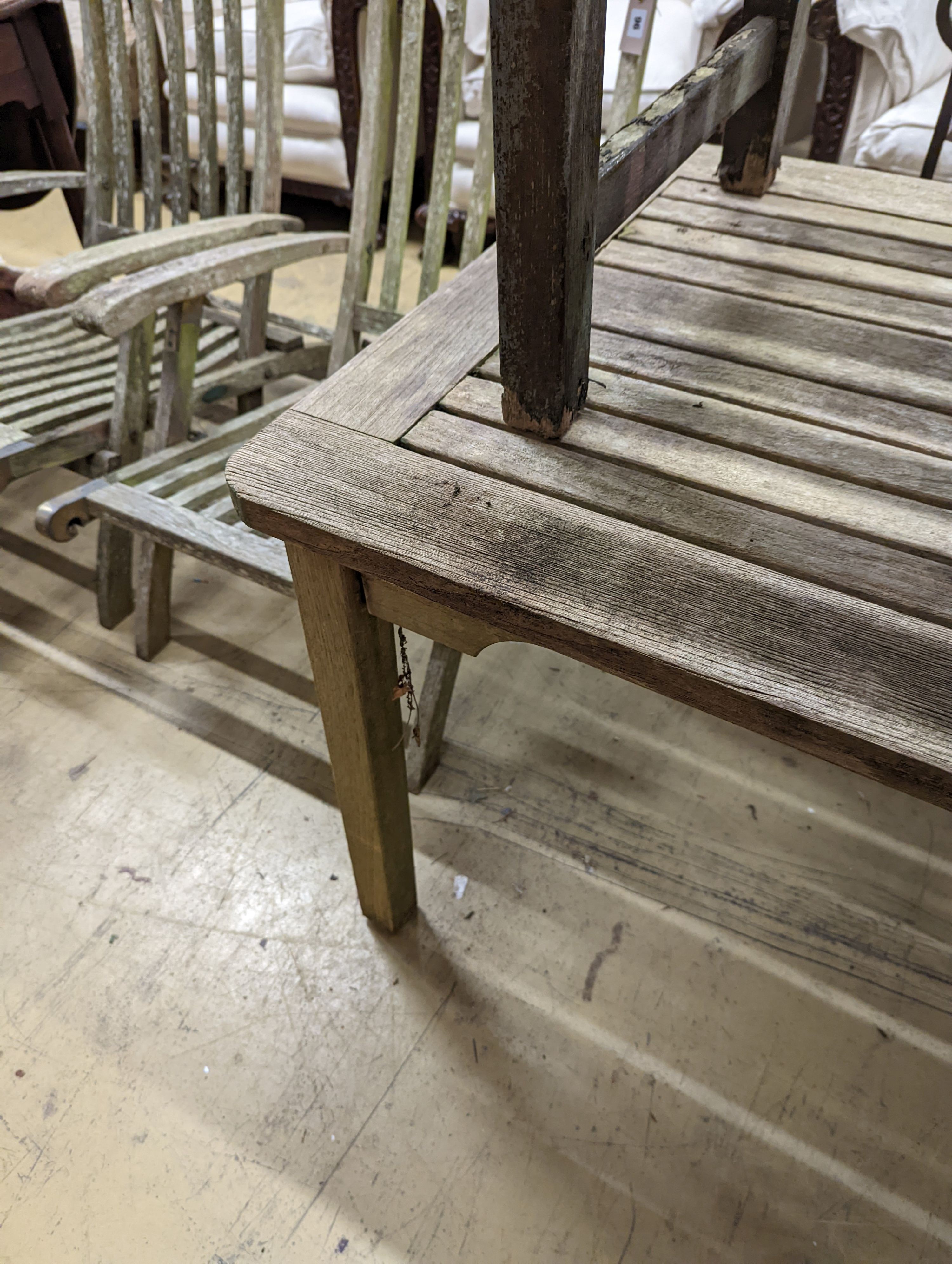 A weathered teak garden bench and rectangular table. Bench - W-122cm, D-54cm, H-83cm. Table - W- - Image 7 of 7