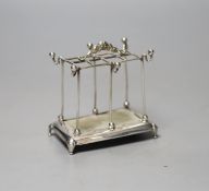 An Edwardian silver mounted hat pin? and ring stand, Mappin Bros. Birmingham, 1909, height 8.1cm.