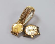 A gentleman's 9ct gold Baume manual wind wrist watch, on a gilt metal flexible strap and a