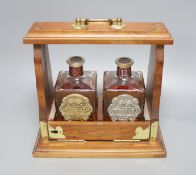 Tantalus containing White and Mockay 21 year and 12 year whiskey, 23 cms high.