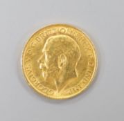 A George V 1911 gold sovereign.