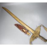 A bayonet with scabbard and a knife, bayonet 71 cms long.
