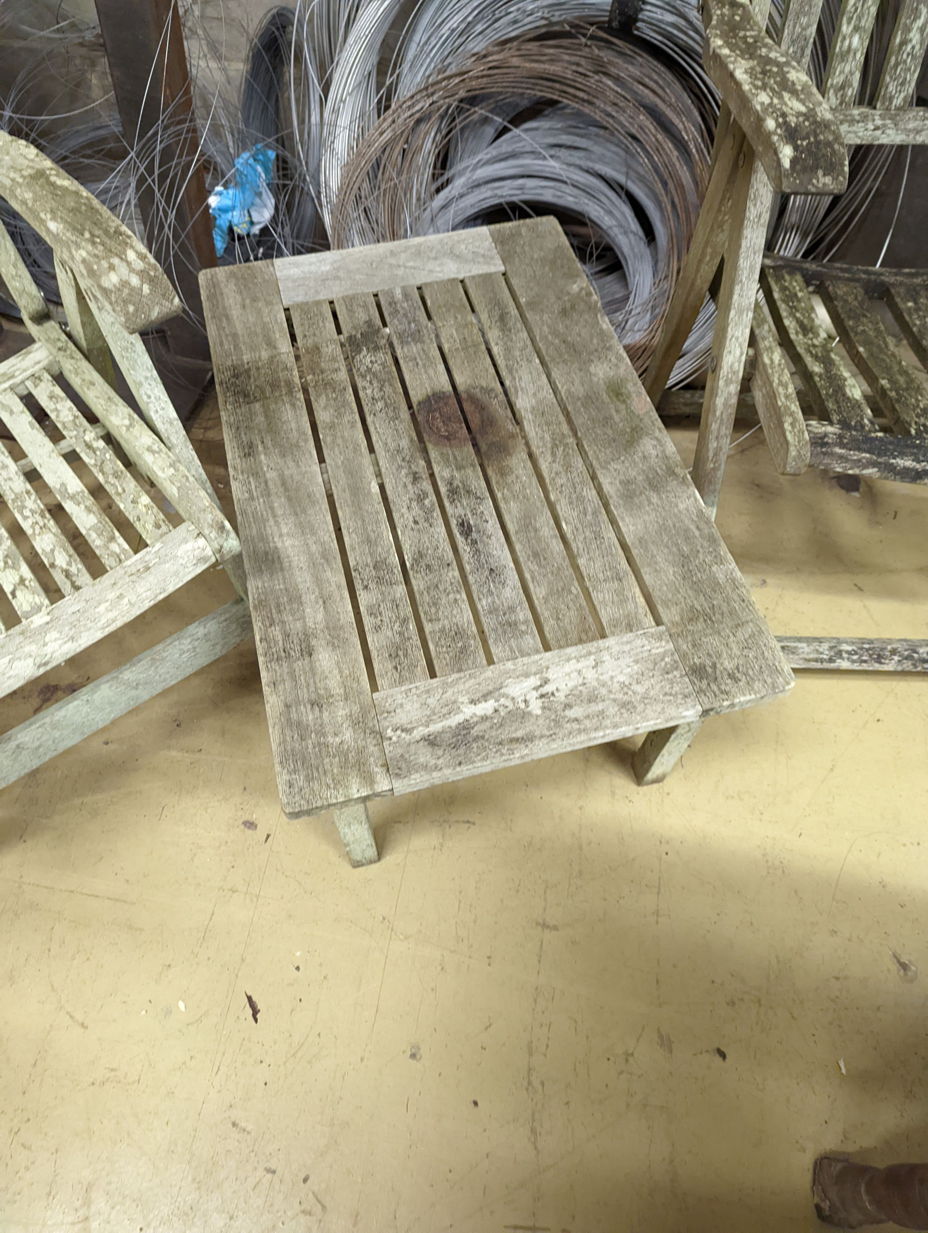 Two weathered teak folding garden armchairs and a low table - Image 3 of 5
