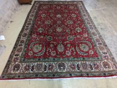 A Tabriz red ground carpet, 400 x 290cm