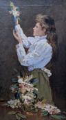 English School, circa 1900, oil on canvas, Young woman arranging flowers, 60 x 35cm