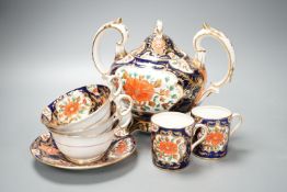 A mid 19th century English bone china fifty-two piece part tea and coffee service, decorated in an