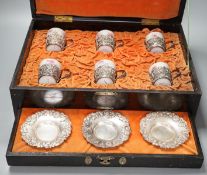 A cased Japanese white metal and eggshell porcelain six piece coffee set, maker’s mark only, case