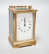 A brass cased French eight day carriage timepiece, 12cm high with key. *This lot is being sold in