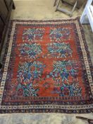 A North West Persian red ground rug with stylised foliate motifs, 185 x 157cm