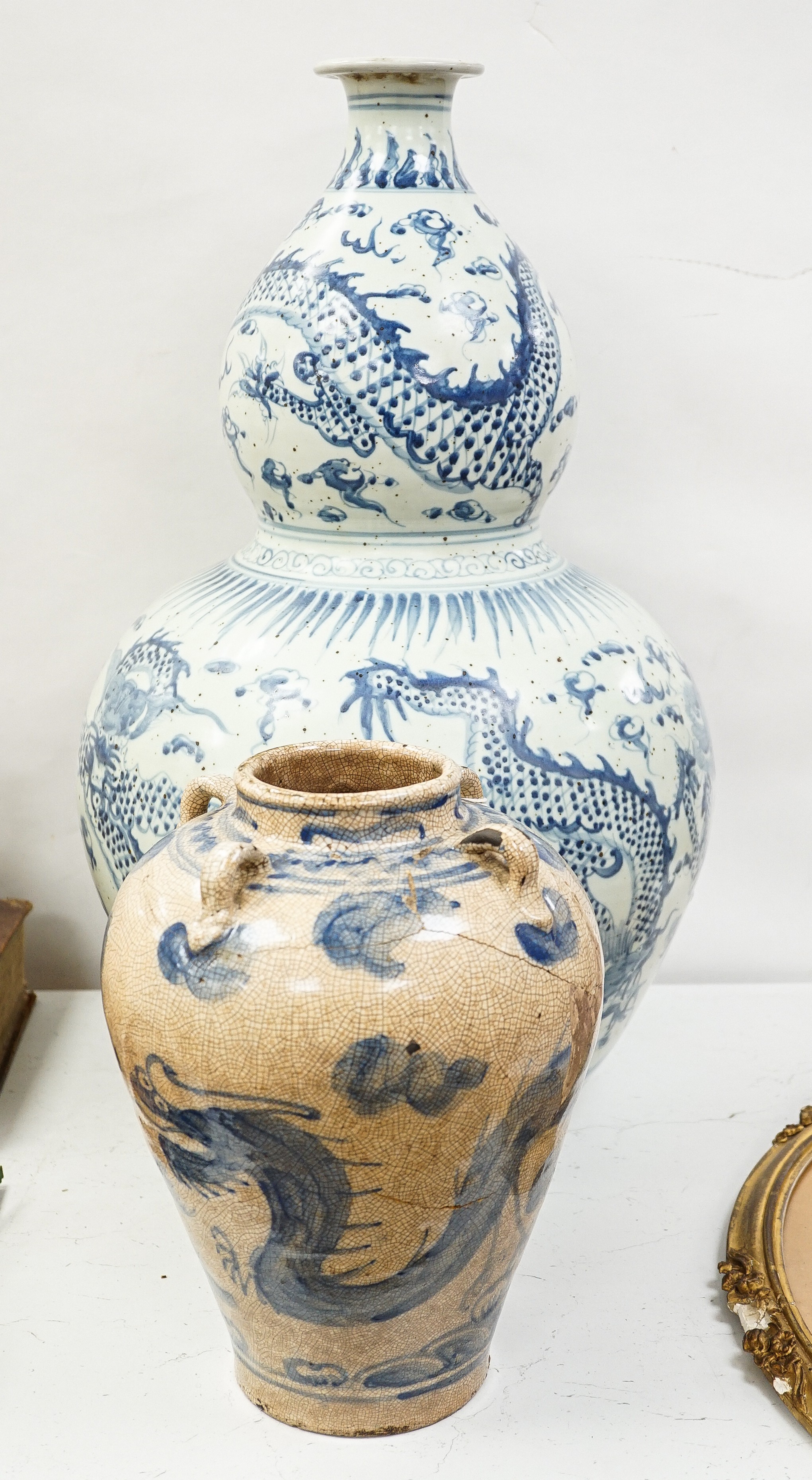 A large Chinese blue and white 'dragon' double gourd vase, 64cm high and an Annamesse style blue and