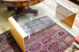 A modern glass and bentwood coffee table, length 128cm, depth 60cm, height 47cm