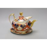 A Barr Flight and Barr Worcester teapot cover and stand painted with an Imari pattern, c.1805, 23 cm