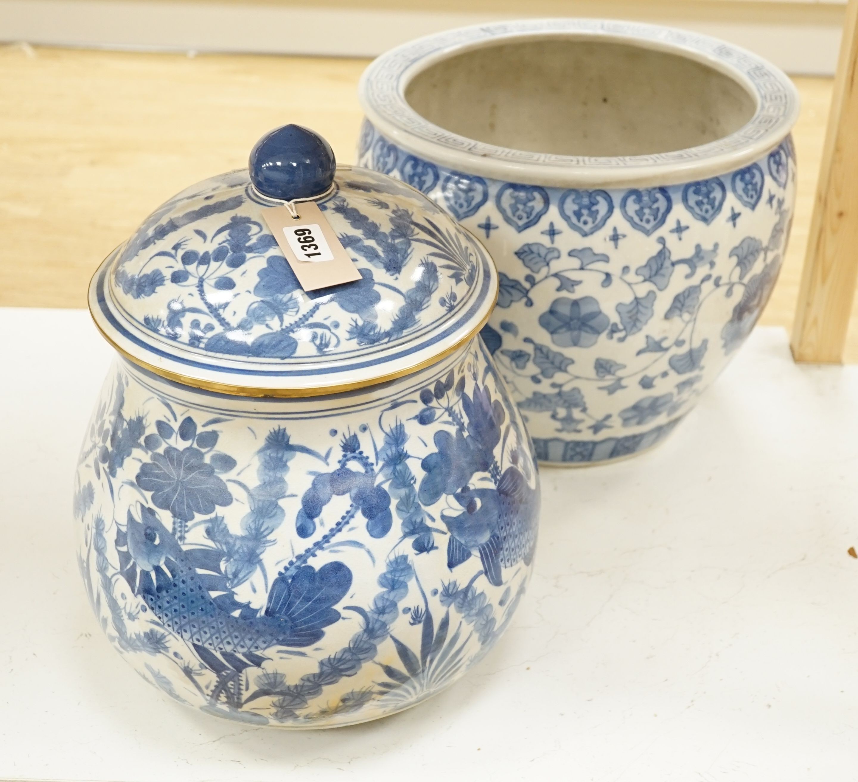 A Chinese blue and white fish bowl and a similar jar and cover, fish bowl 20 cms diameter.