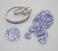 A modern 925 and tanzanite set hinged bangle, a similar pair of earrings and pendant and a rough cut