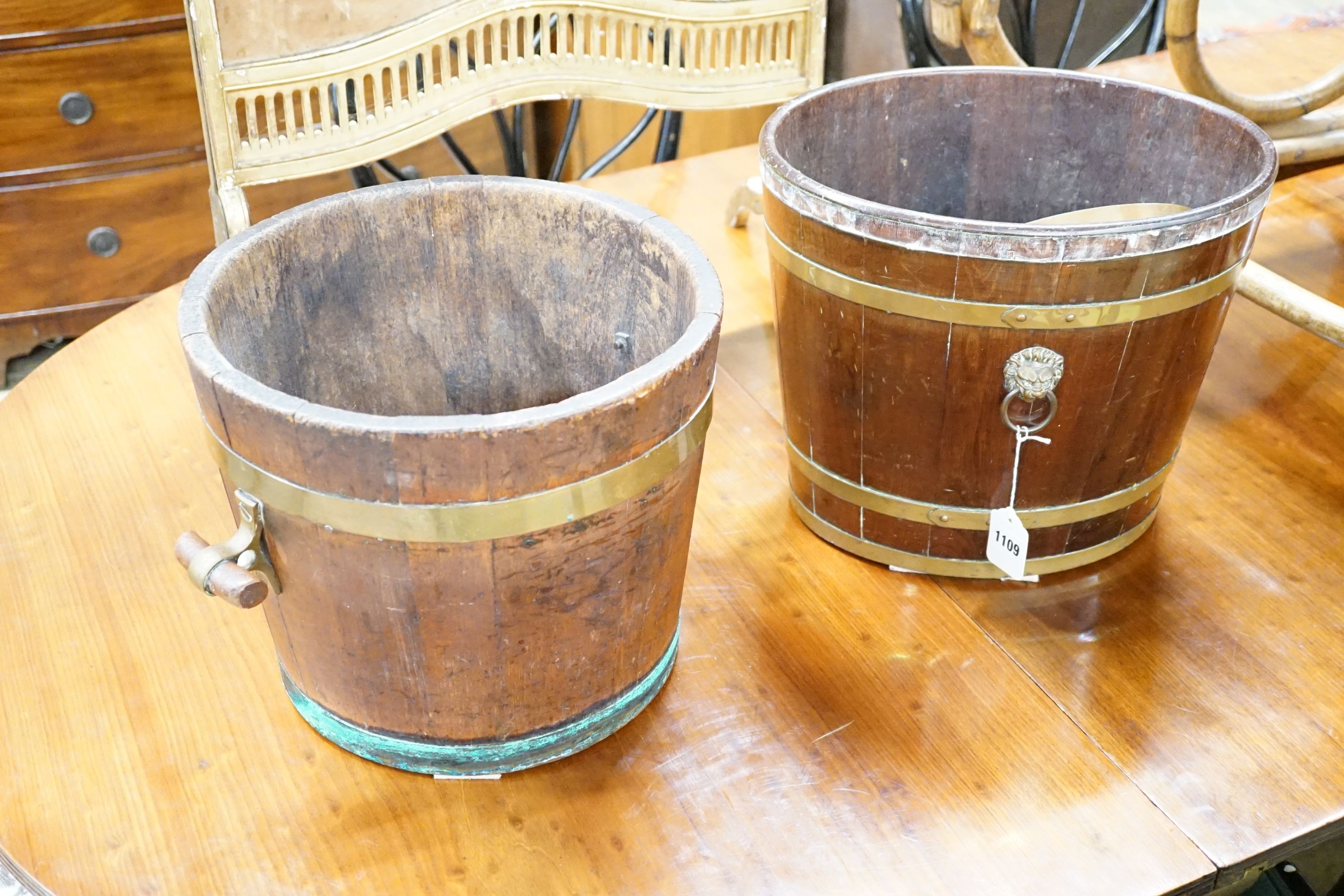 A 19th century brass bound mahogany oval bucket and a similar brass bound oak bucket, width 37cm,