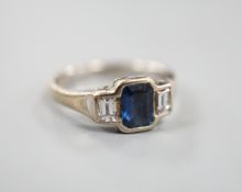 A modern 18ct white gold, collet set sapphire and diamond three stone ring, size L, gross weight 3.8