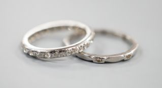 A white metal and diamond chip set full eternity ring, size J and a white metal (stamped Pt) and