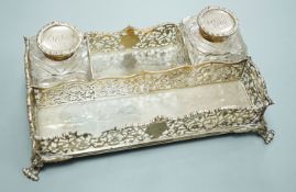 A late Victorian pierced silver twin inkstand, with two mounted glass inkwells, (a.f.), London,