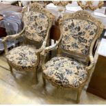 A pair of Louis XVI style carved giltwood upholstered open armchairs, width 72cm, depth 54cm, height