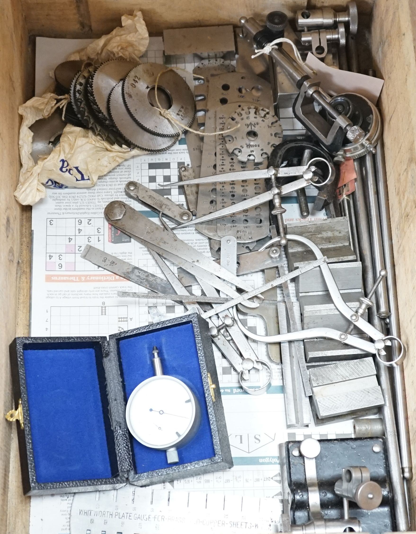A collection of 20th century high precision metal measuring devices, including callipers, Compac