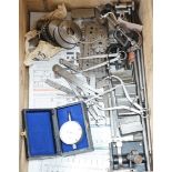 A collection of 20th century high precision metal measuring devices, including callipers, Compac