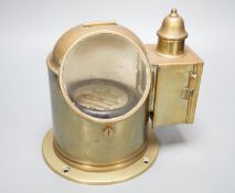 A brass ship's binnacle compass, 22cms wide x 22 cms high.