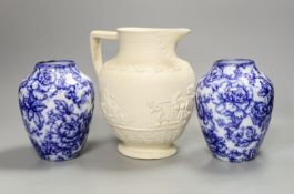 A pair of Keelings blue and white floral vases and a 19th century relief moulded white stoneware