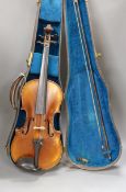 A cased violin, with bow