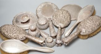 A mixed collection of four silver mounted vanity mirrors, four assorted clothes brushes, (