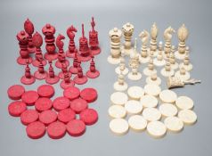 A 19th century Chinese export Burmese pattern carved and stained ivory chess set, one white pawn