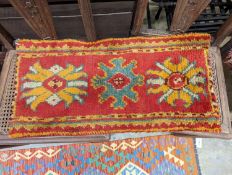 Two antique Oushak Turkish rugs, 77 x 40cm and 72 x 36cm