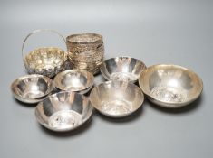 Four small Rangoon white metal bowls together with a simile basket and six small white metal bowls