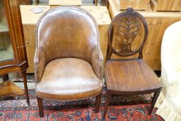A brown leather upholstered desk chair, a mahogany hall chair and two upholstered armchairs