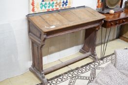 A Victorian oak and pine double school desk, width 120cm, height 98cm