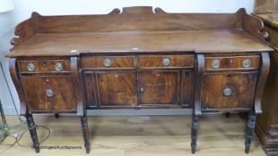 A Regency mahogany inverse breakfront sideboard. W-184, D-60, H-108cm.