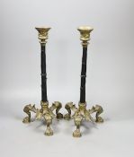 A pair of French ormolu puma footed candlesticks 33cm