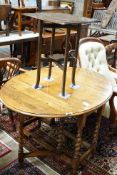 A 1920's oak gateleg table opens to 117 x 90cm and an Edwardian carved oak folding occasional table,