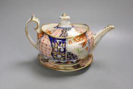 A Chamberlain teapot cover and stand painted with an Imari pattern, c.1810, 26cm long