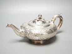 A Victorian embossed silver teapot, Walter Morrise, London, 1842, gross 15.5oz.