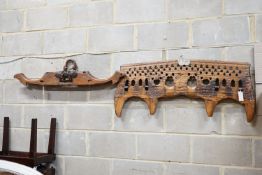 A carved hardwood ox yoke with plaque inscribed Antonio Gonzalez Vila Verde, width 110cm and another