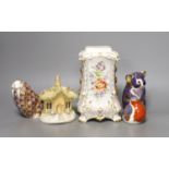 Three Crown Derby animal paperweights, a pastel burner cottage and a Continental gilt and floral