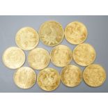 Ten Austrian gold Ducats (re-strikes) and an Italian 750 yellow metal 'I Star Lina de Amicizia',