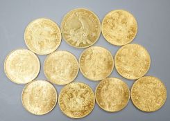 Ten Austrian gold Ducats (re-strikes) and an Italian 750 yellow metal 'I Star Lina de Amicizia',