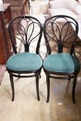 A set of four Thonet ebonised bentwood dining chairs, upholstered seats, stamped mark