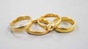 Two 22ct gold wedding bands, 10.3 grams, a George V 18ct gold wedding band and a Victorian 18ct gold