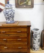 A Chinese style blue and white lidded baluster vase and a cylindrical stick stand (2)