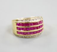 A modern 14k yellow metal, five row ruby and diamond set dress ring. size O, gross weight 4.9