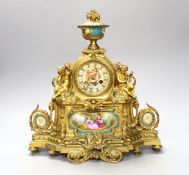 A 19th century French ormolu and Sevres style porcelain mounted mantel clock, with key and pendulum,